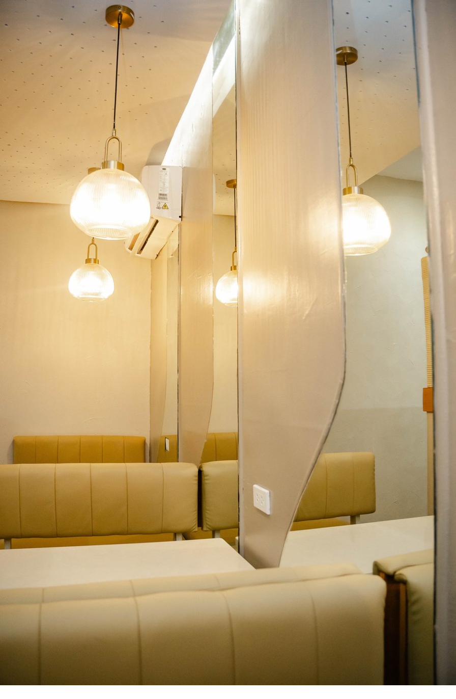 Pendant lights and mirrored partition detail