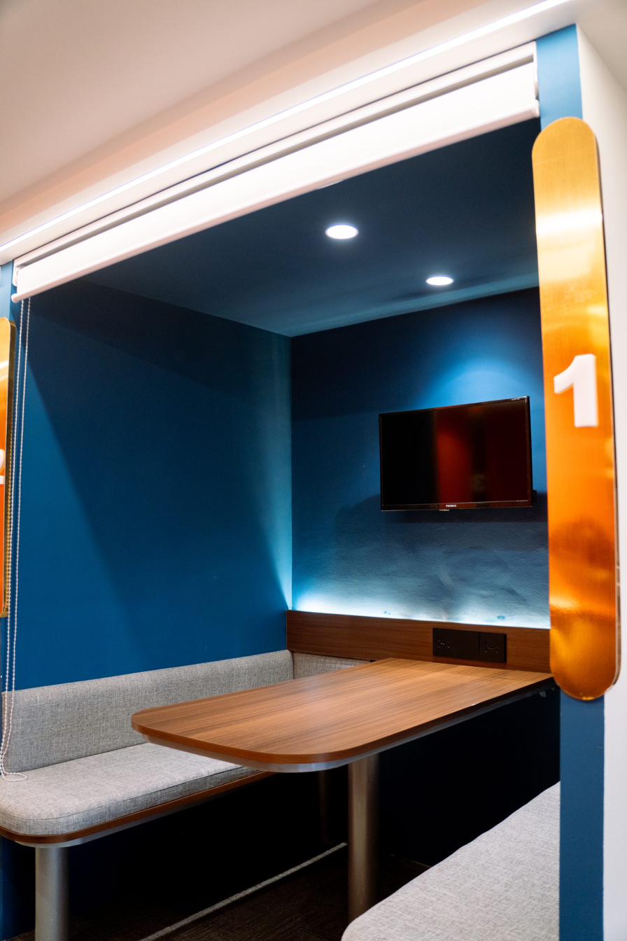 Six-seater blue booth with TV